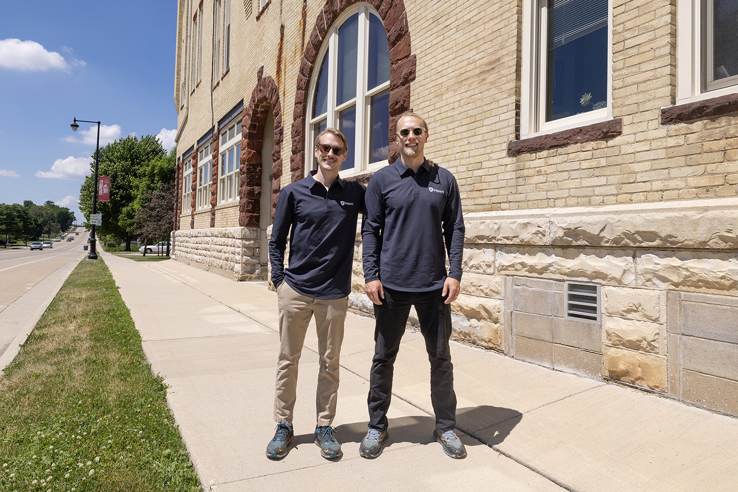 Wesley Hartkemeyer and Nick Uthe outside a city building